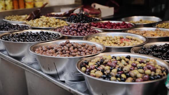 Olives stall in the Tel Aviv "Carmel Market" famous touristic market. Different kinds of olives are alt
