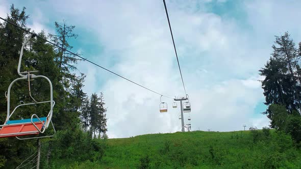 View From the Chair of the Cable Car on the Panorama of the Mountains on a Summer Sunny Day alt