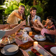 Multi-ethnic family celebrate weekend reunion gathered together, enjoy party outdoors in the garden. - PhotoDune Item for Sale