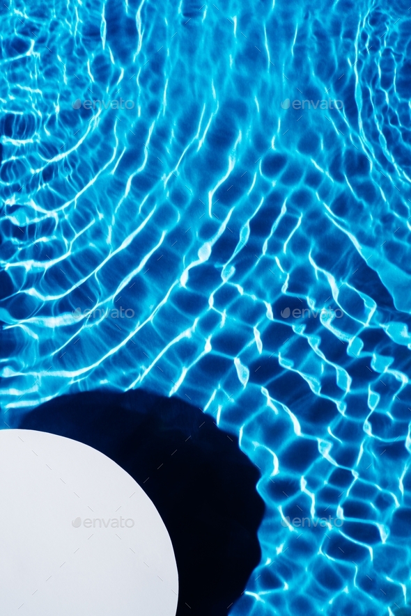 White quarter circle copy space in transparent fresh blue water gel surface. Flecks, waves, shade