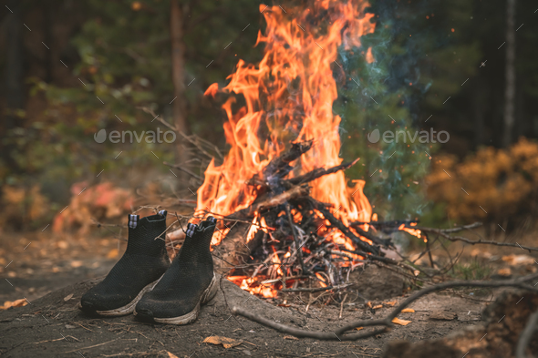 shoes near the campfire, active outdoor recreation, camping