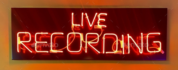Live Recording neon sign lighted up in red colour