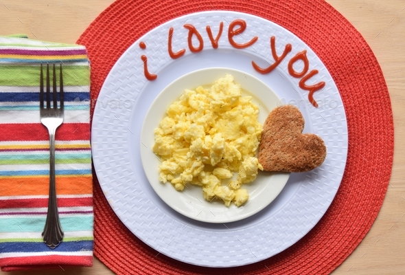 Food, words, scrambled eggs plated I love you top view lay flat