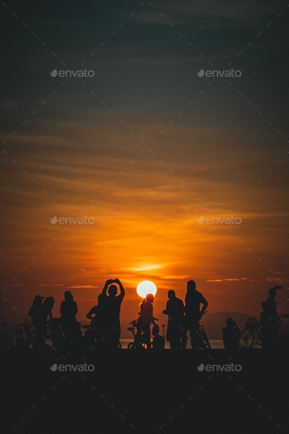 silhouette of a group of people at sunrise