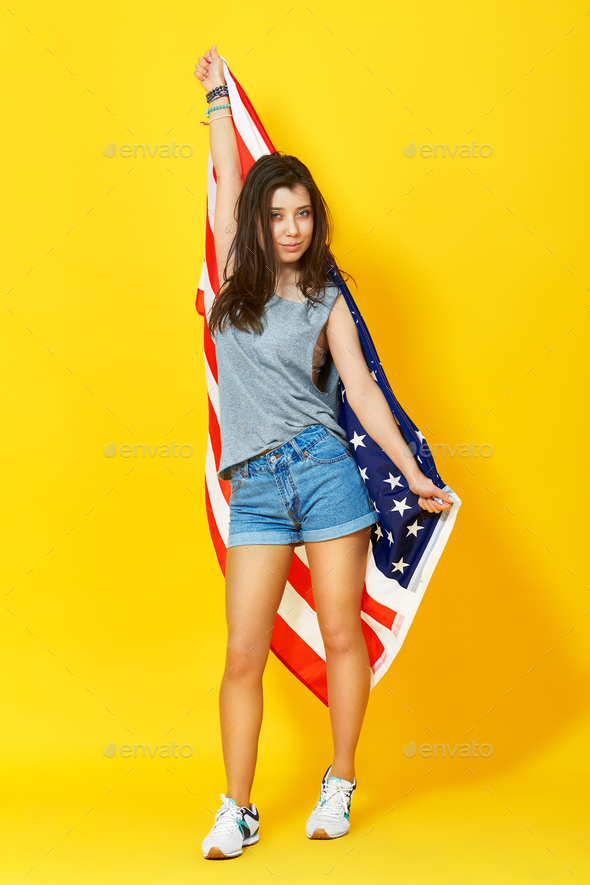 young woman holding american flag