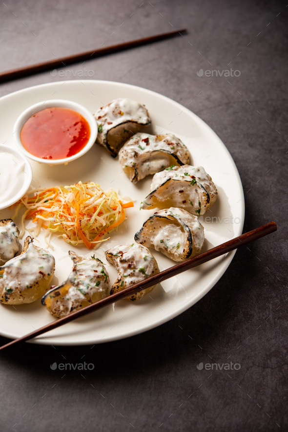 Tandoori momo, veg or non veg in red and cream sauce, served with sauce. Nepal and Tibet recipe