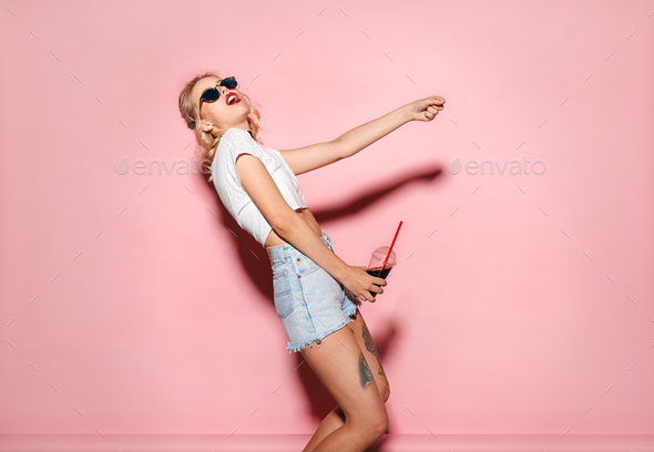Woman drinking coke and having fun