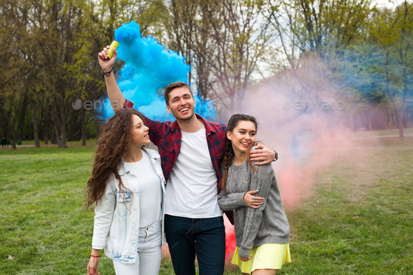 Guy with smoke flare and girls