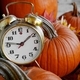 An old fashion alarm clock is nestled amongst harvested  pumpkins and autumn leavesNOMINATED - PhotoDune Item for Sale