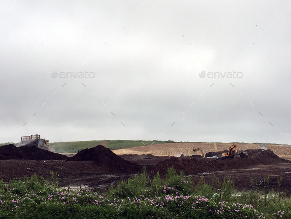 Mulching at the landfill - Stock Photo - Images
