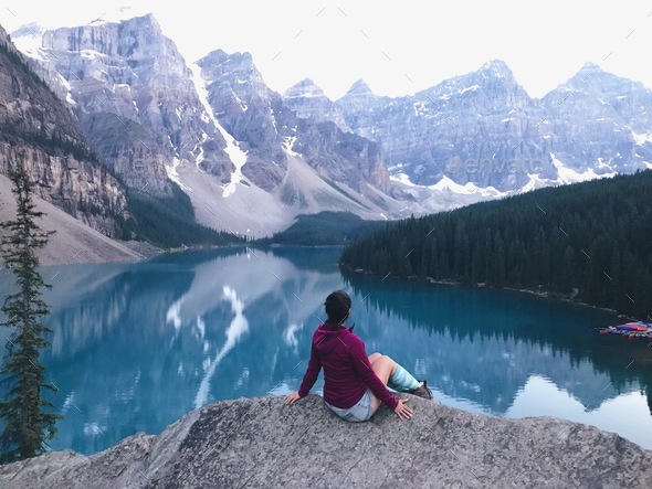 NOMINATED Girl sitting in front of Moraine Lake Canadian Rockies Stock ...