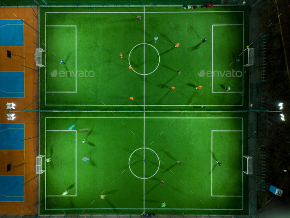 Aerial view of a mini football match, soccer. MiniFootball field and Footballers from drone
