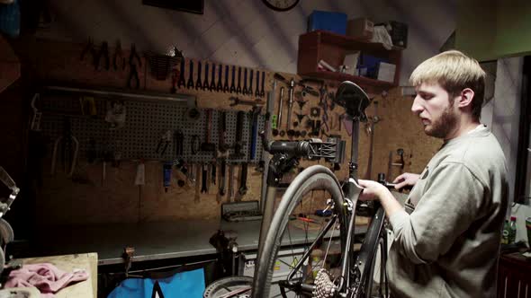 Mechanic Preparing Bicycle for Repairing