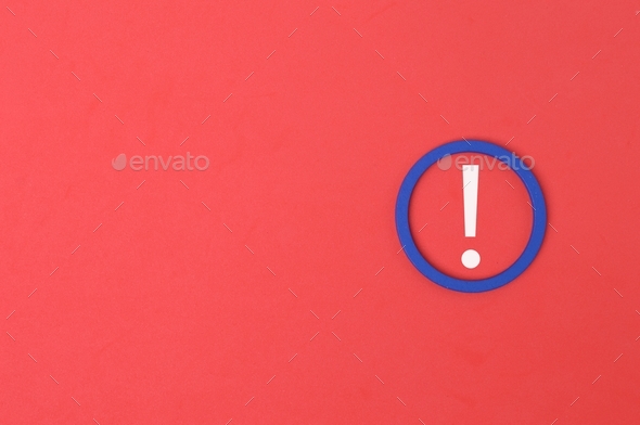 Exclamation mark drawn on red background with copy space.