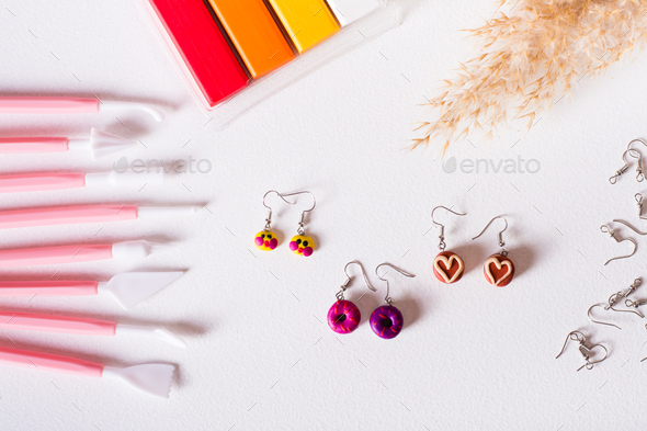 Polymer clay earrings, material and tools for work. Handmade. Top view.