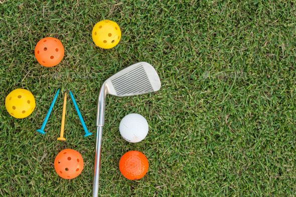Golf Ball and Golf Club on grass - Stock Photo - Images