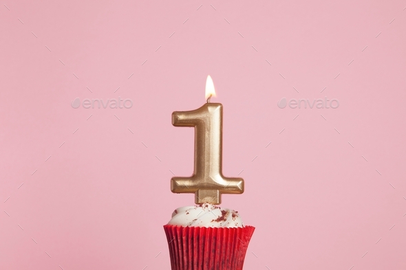 Gold number one birthday celebration candle in a cupcake Stock Photo by ...