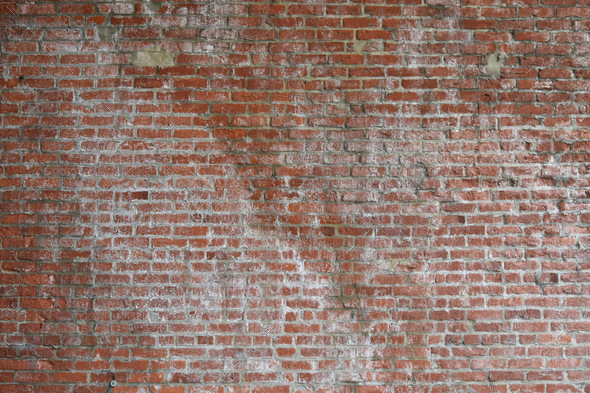Rustic weathered old brick wall with crack patches texture for background, wallpaper design