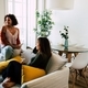 Two young women drinking wine in a modern stylish apartment - PhotoDune Item for Sale