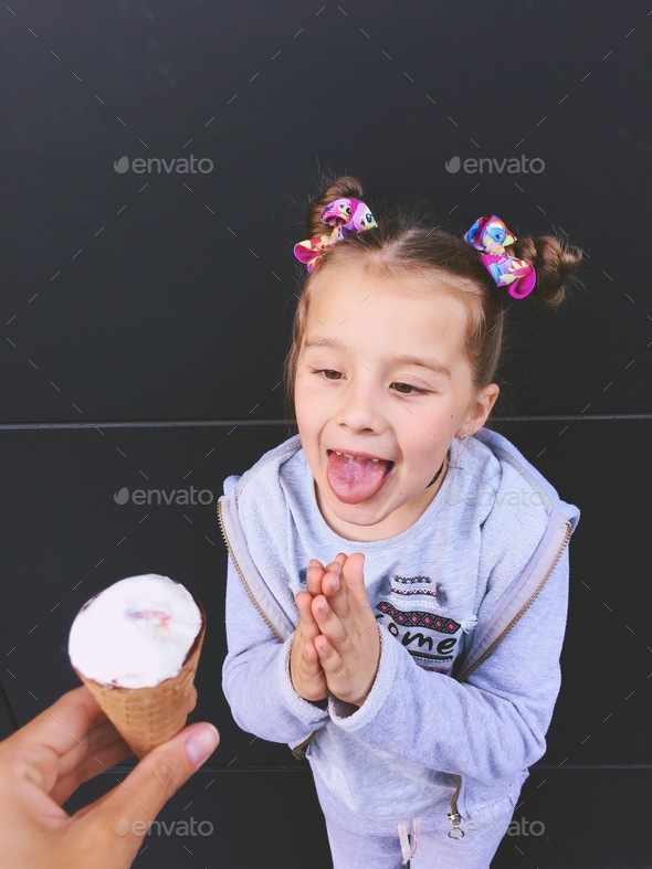 Little girl begging for an ice cream Stock Photo by nikoletta21 PhotoDune