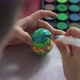 Close-up, a boy is painting an Easter egg - VideoHive Item for Sale