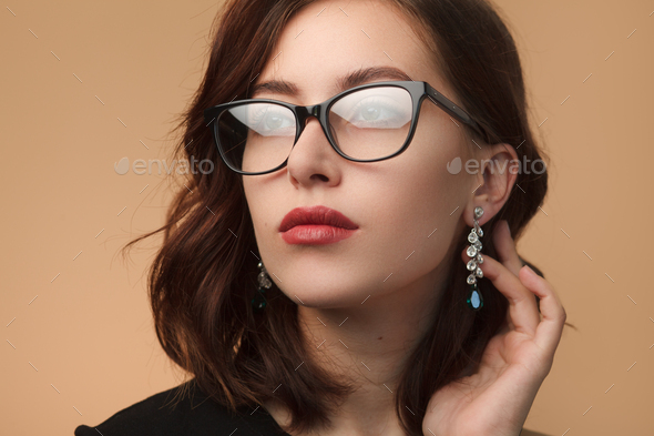 Beautiful woman in black rimmed spectacles