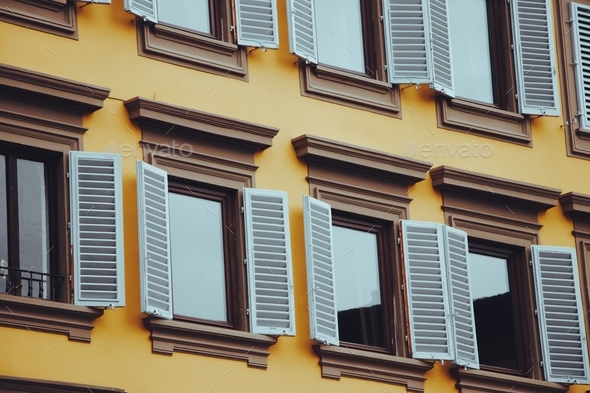 Yellow. Geometric pattern. Windows. Bright. Europe architecture. - Stock Photo - Images