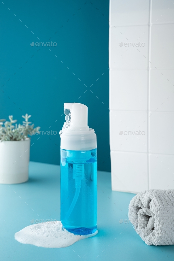 Beauty product mockup. Wellness packaging. Blue bottle, Cleaning cosmetic. Plastic pump bottle for a