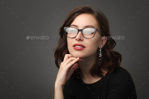 Beautiful woman in black rimmed glasses