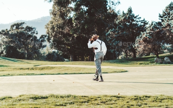 Black man on a sunny golf field
