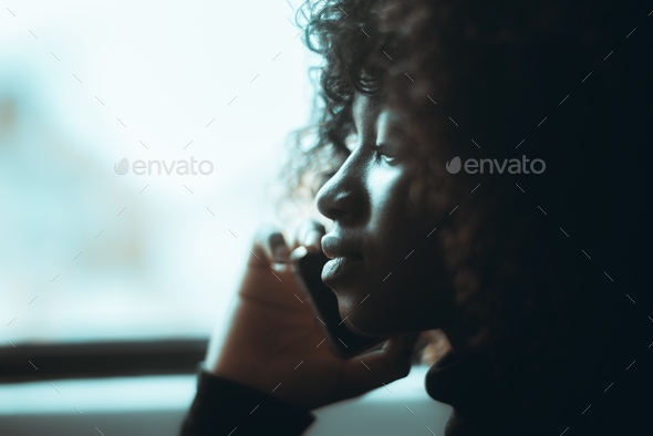 Portrait of a phoning black girl - Stock Photo - Images