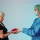 Conceptual Shot of a Surgeon Giving Heart Transplant to an Elderly Lady Gift of New Life From the