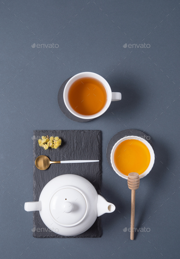 black tea ceremony with honey on dark gray background. Top view Stock