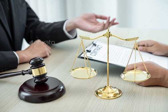 lawyer or counselor discussing negotiation legal case with client meeting with document contract - Stock Photo - Images