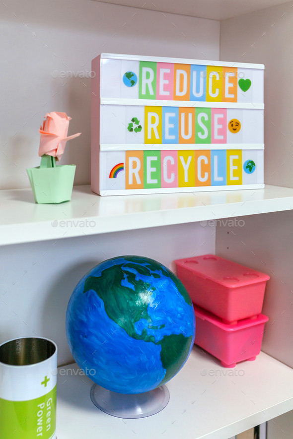 Lightbox with text reduce, reuse, recycle and earth globe on shelf in ...
