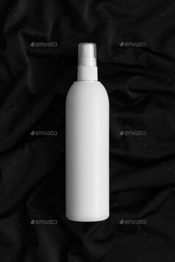 White cosmetic spray bottle mockup on the black textile.