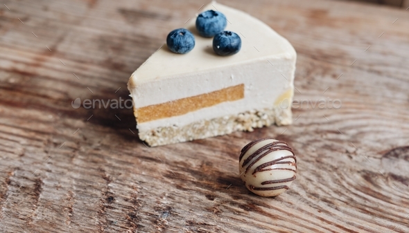a piece of gluten-free blueberry cake and a ball of dried fruit candy, sugar-free