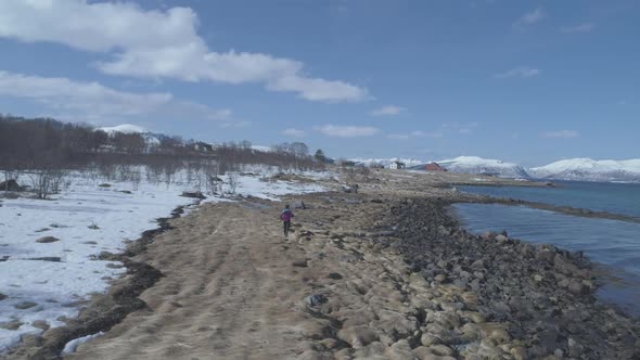 Female Runner on the nordic beach