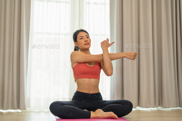 Young beautiful lady breathing peaceful meditation pilates yoga muscle exercise in leaving room