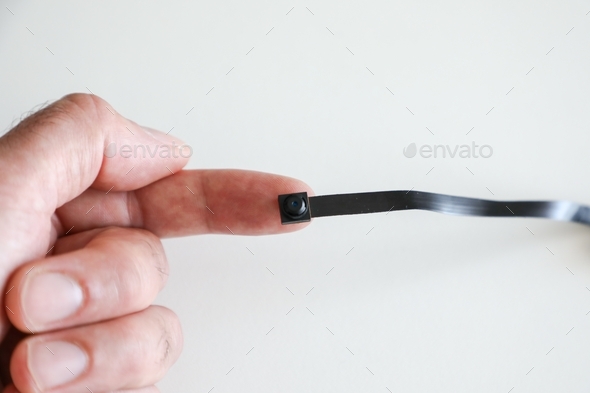 a micro camera is held between the fingers
