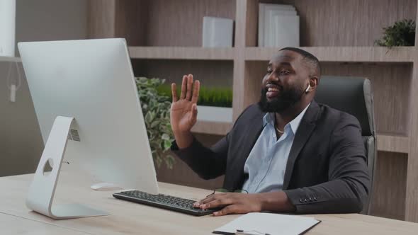 African American Mature Business Man Executive Waving Hand Using Laptop Computer Having Video alt