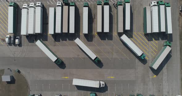 Buildings of Logistics Center, Warehouses Near the Highway, Truck Parking Process, View From Height alt
