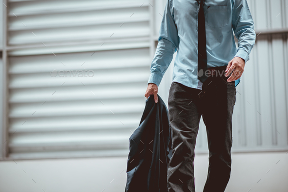 Businessman walking after failure and layoff. Man unemployed from company waliking sad outside