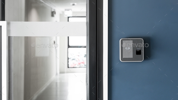 Finger or card scanner device placed on blue wall to unlock the entrance door