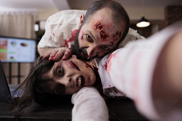Scary horror zombies biting wounds in office