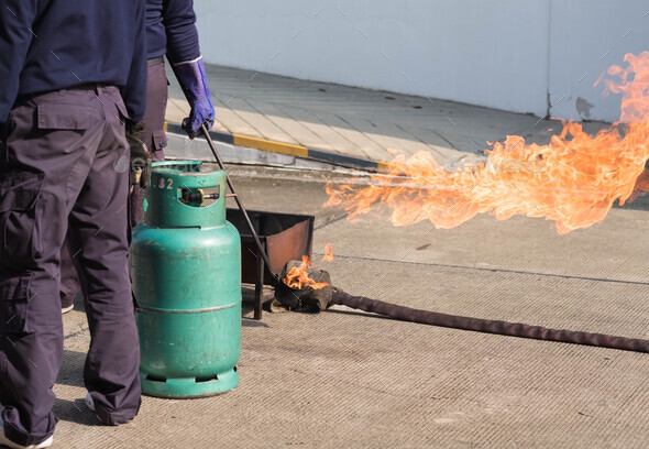 The instructor demonstrate and training the fire extinguisher use, fire evacuation training.
