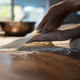 Low angle view of a woman stretching and pulling homemade vegan pastry dough - PhotoDune Item for Sale
