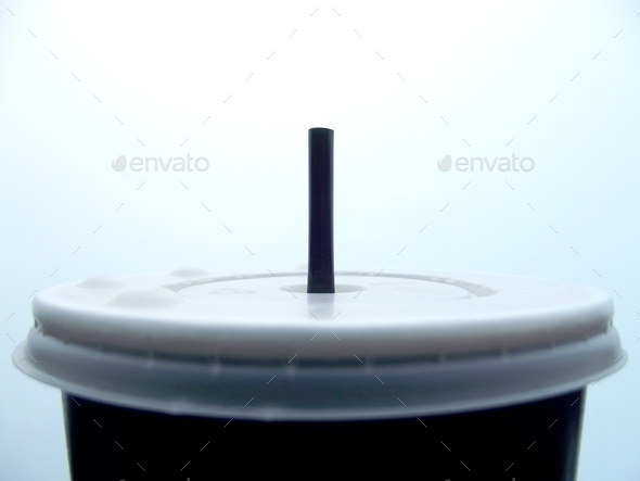 Plastic disposable soda cup and straw