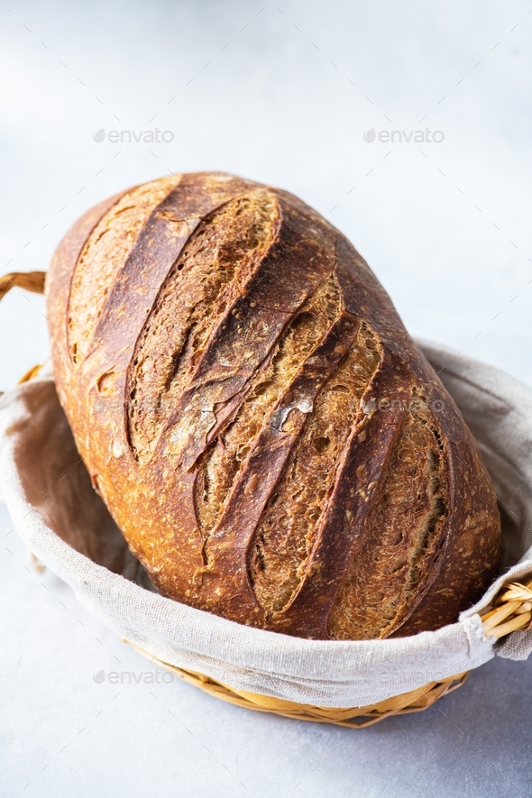 Sourdough bread in a bread basket Stock Photo by galiyahassan PhotoDune