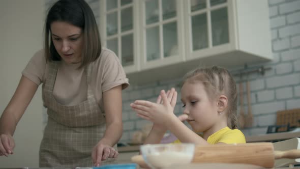 Mom and Daughter Cooking Cookies Together